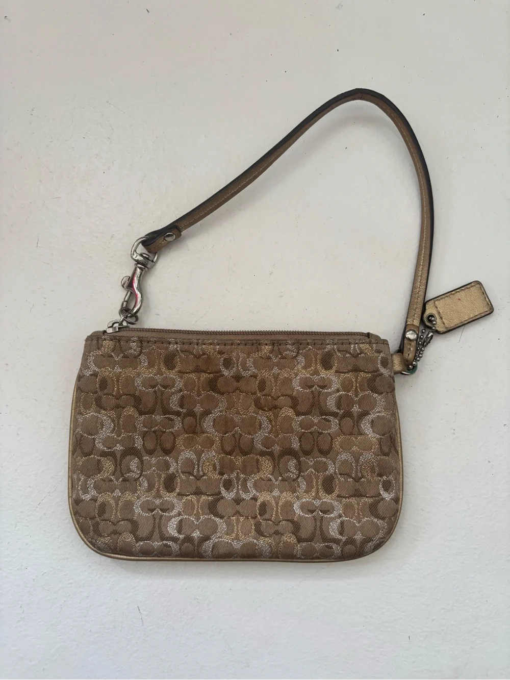 Coach metallic gold signature jacquard wristlet